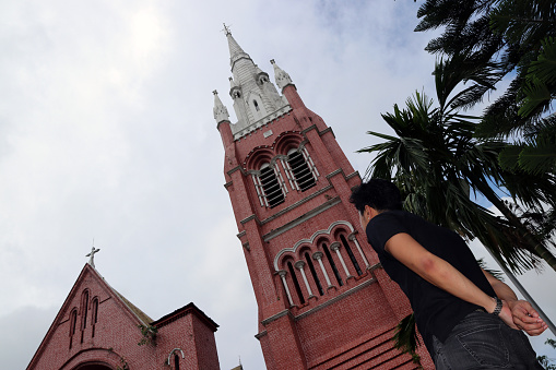 Teen in front of church